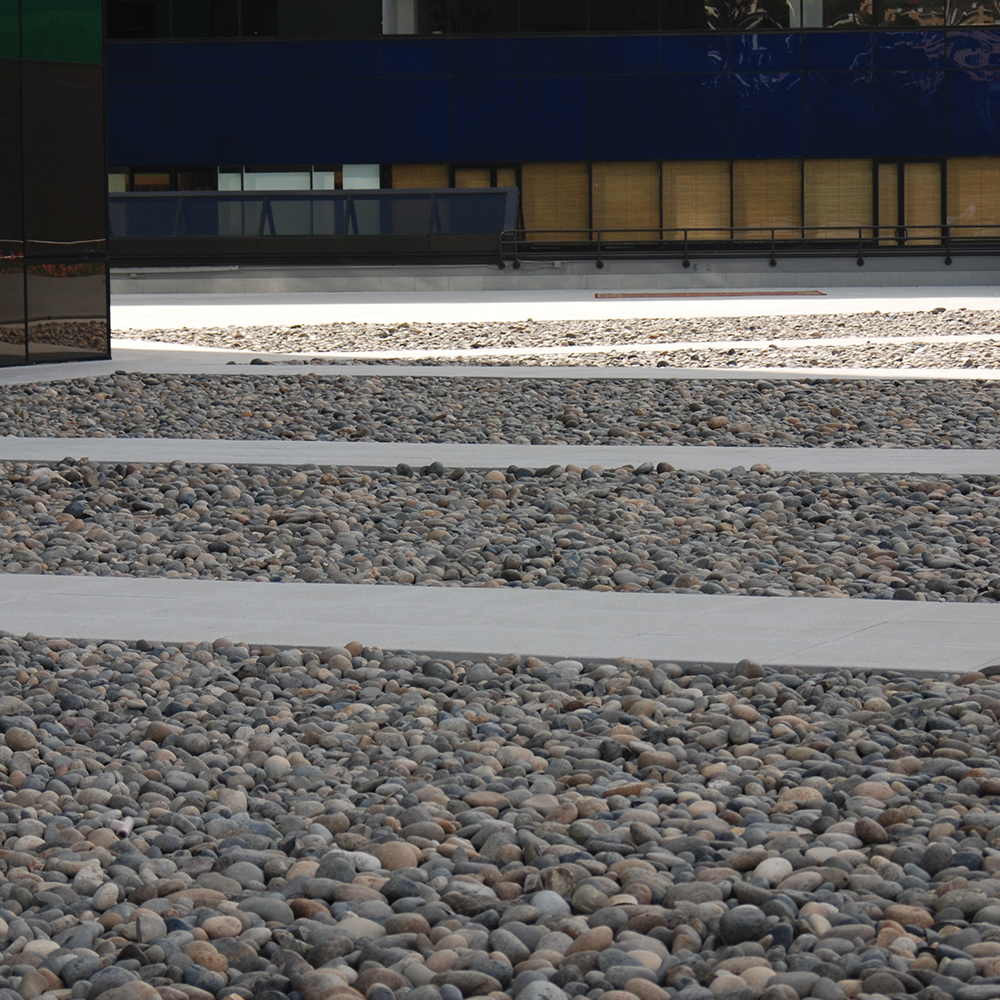 These gray walkways are surrounded by neutral color stones.