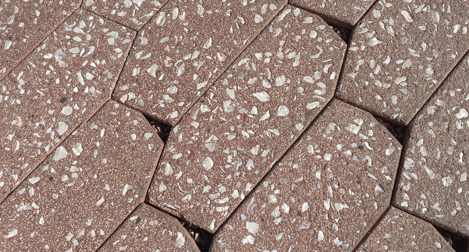 A close-up image of Wausau Tile’s V-Series permeable pavers in a brown color.