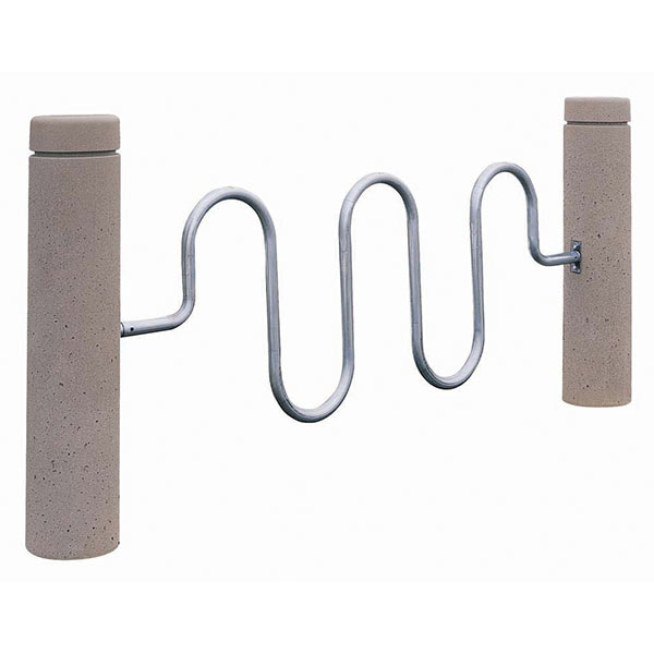 A silver, five-loop bike rack elevated by two stone cylindrical bollards on each side